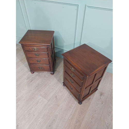 91 - Pair of good quality oak bedside lockers with four graduated short drawers on bun feet. {70 cm H x 4... 