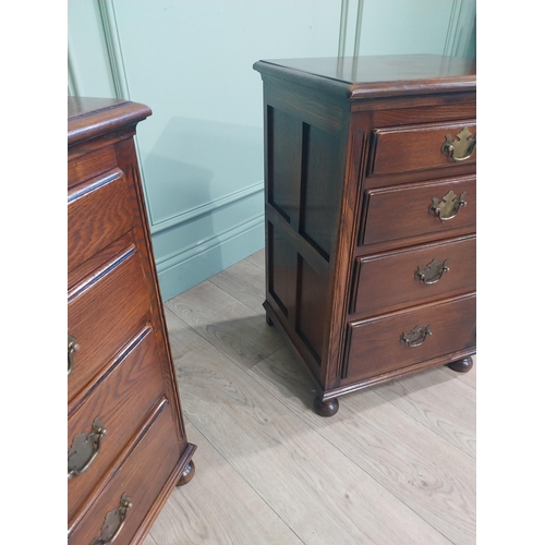 91 - Pair of good quality oak bedside lockers with four graduated short drawers on bun feet. {70 cm H x 4... 