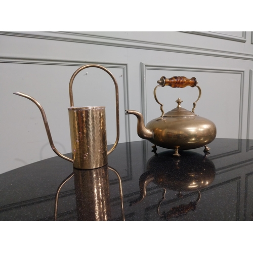 96 - Two Edwardian brass kettles. {20 cm H x 26 cm W x 18 cm } and {24 cm H x 22 cm W x 18 cm D}.