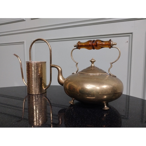 96 - Two Edwardian brass kettles. {20 cm H x 26 cm W x 18 cm } and {24 cm H x 22 cm W x 18 cm D}.