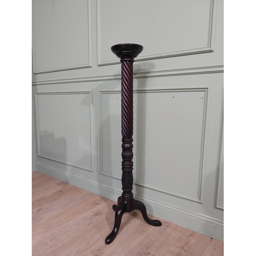 99 - Mahogany torchiere in the Victorian style. {135 cm H x 50 cm Dia.}.