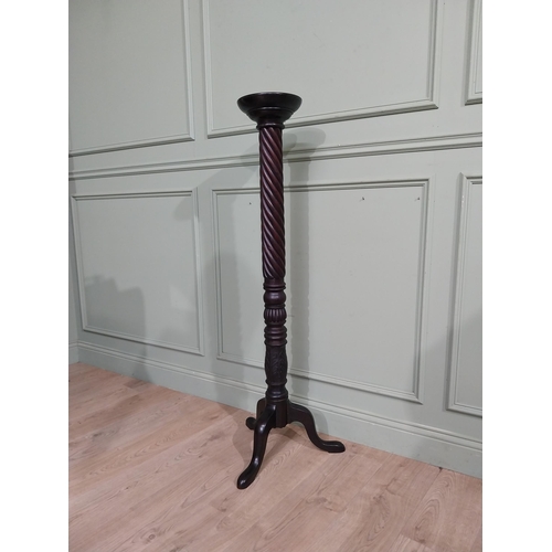 99 - Mahogany torchiere in the Victorian style. {135 cm H x 50 cm Dia.}.