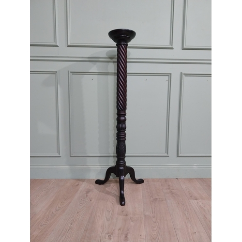 99 - Mahogany torchiere in the Victorian style. {135 cm H x 50 cm Dia.}.