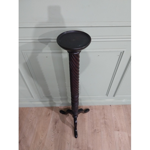 99 - Mahogany torchiere in the Victorian style. {135 cm H x 50 cm Dia.}.