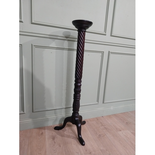 99 - Mahogany torchiere in the Victorian style. {135 cm H x 50 cm Dia.}.