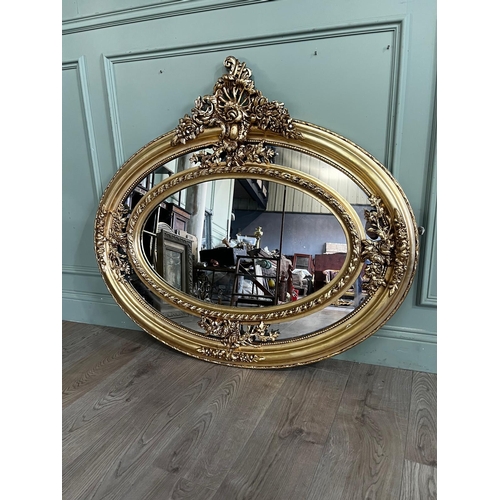 800 - Decorative French gilt oval wall mirror in the Victorian style