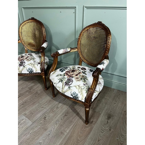 70a - Pair of French giltwood open armchairs with bergere backs and upholstered seats, in the Victorian st... 