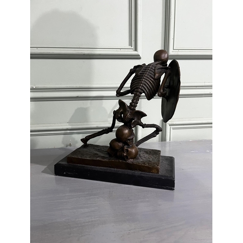 90a - Bronze skeleton figure of a warrior with shield, mounted on a marble base. { 29cm H X 28cm W X 12cm ... 