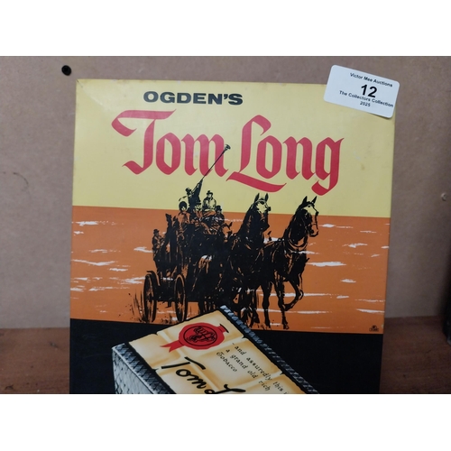 12 - Ogdens Tom Tom cellophane advertising showcard. {27 cm H x 18 cm W}.