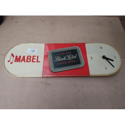 122 - Mabel Black Label battery operated advertising clock. {15 cm H x 46 cm W}.