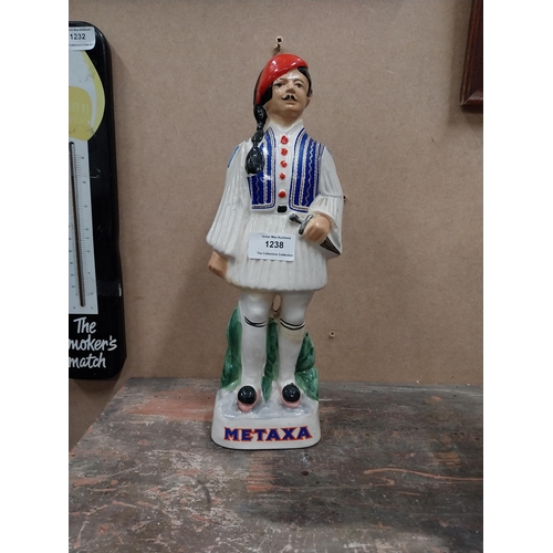 1238 - Metaxa ceramic advertising bottle. {32 cm H x 11 cm W x 8 cm D}.