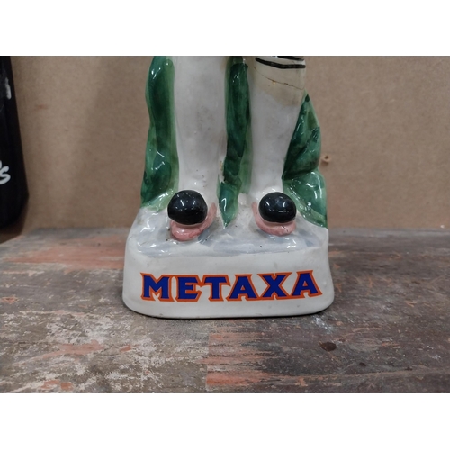 1238 - Metaxa ceramic advertising bottle. {32 cm H x 11 cm W x 8 cm D}.