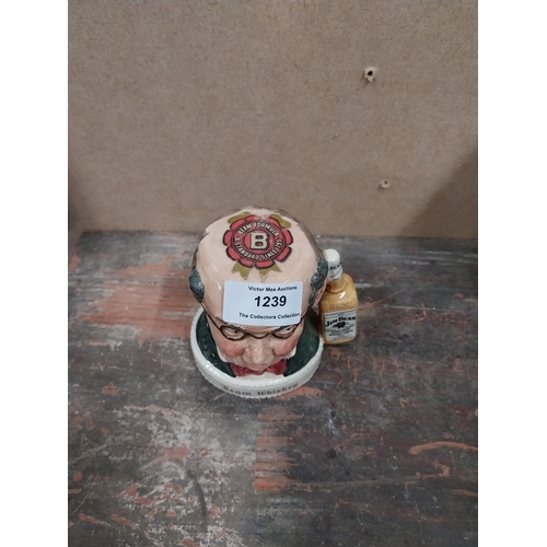 1239 - Jim Beam Royal Doulton ceramic advertising figure. {10 cm H x 10 cm W x 7 cm D}.