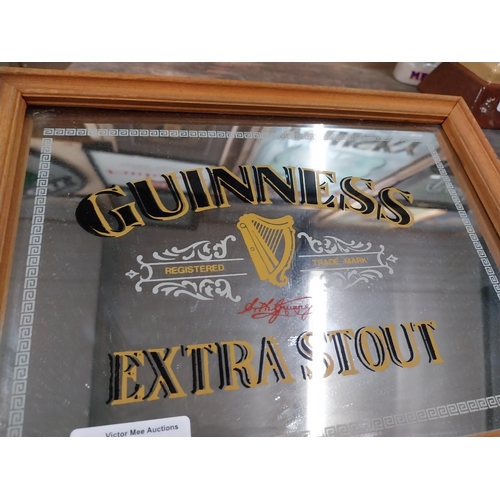 1241 - Guinness Extra Stout framed advertising mirror {21 cm H x 27 cm W}.