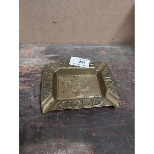 1242 - Two Odgens Guinea Gold brass ashtrays. {2 cm H x 12 cm W x 10 cm D}.