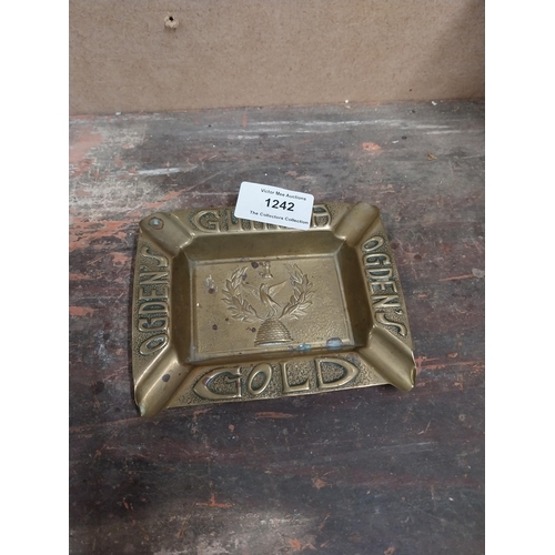 1242 - Two Odgens Guinea Gold brass ashtrays. {2 cm H x 12 cm W x 10 cm D}.