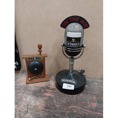 1243 - Guinness On The Air microphone {25 cm H x 12 cm W} and New York City bar bell {15 cm H x 9 cm W x 4 ... 