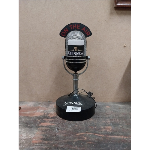 1243 - Guinness On The Air microphone {25 cm H x 12 cm W} and New York City bar bell {15 cm H x 9 cm W x 4 ... 