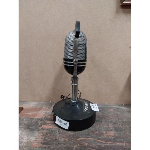 1243 - Guinness On The Air microphone {25 cm H x 12 cm W} and New York City bar bell {15 cm H x 9 cm W x 4 ... 