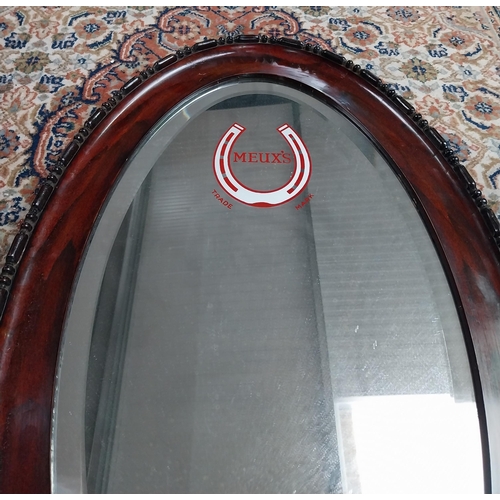 131 - Meux's oval framed advertising mirror. {81 cm H x 51 cm W}.