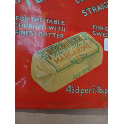 144 - Tee Gee Margarine celluloid advertisement. {23 cm H x 32 cm W}.