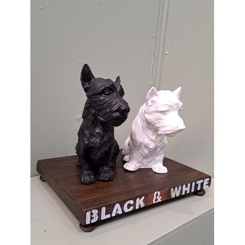 159 - Black and White Scotch Whisky advertising dogs on wooden base. H 23cm x W 28cm x D 22cm