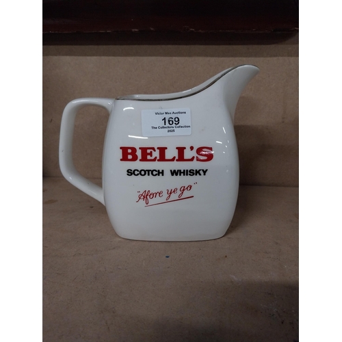 169 - Bell's Scotch Whiskey and Canadian Club Wade ceramic water jugs. {15 cm H x 17 cm W x 12 cm D and 14... 