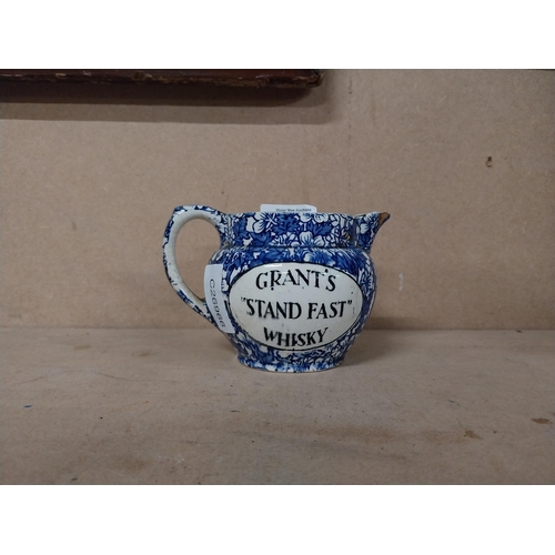 174 - Grant�s Whiskey ceramic water jug. {10 cm H x 15 cm W x 9 cm D}.