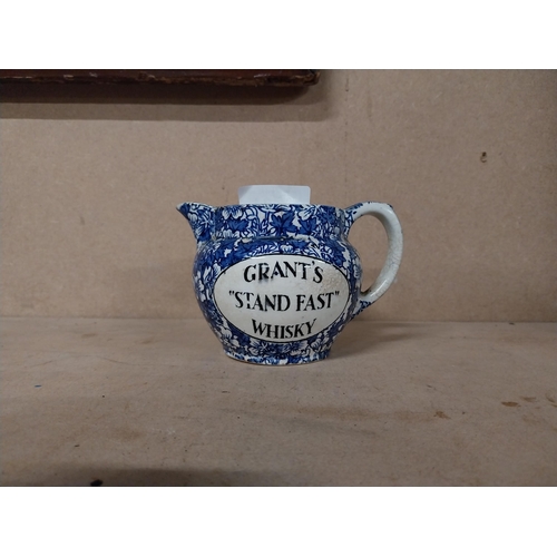 174 - Grant�s Whiskey ceramic water jug. {10 cm H x 15 cm W x 9 cm D}.