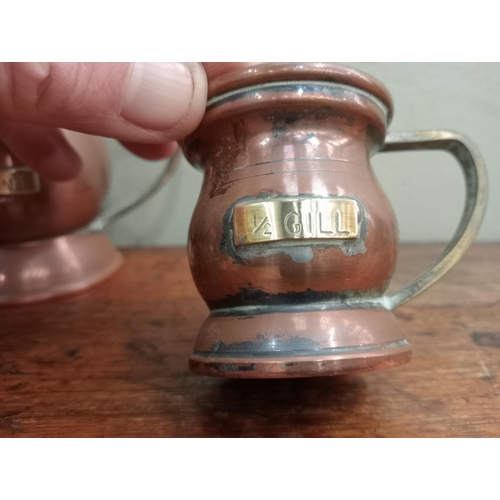 200A - Set of six graduated copper tankards , 1 Quart, 1 pint, 1/2 pint , 1 gill, 1/2 gill, 1/4 gill H 13cm... 