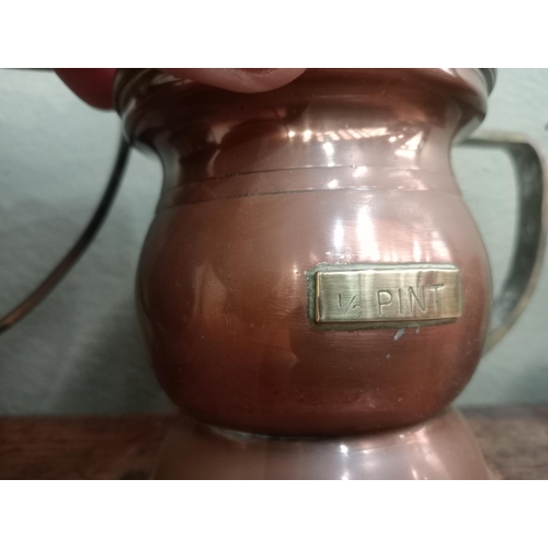 200A - Set of six graduated copper tankards , 1 Quart, 1 pint, 1/2 pint , 1 gill, 1/2 gill, 1/4 gill H 13cm... 