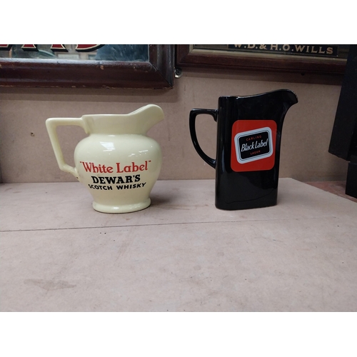 207 - Black Label Wade water jug {16 cm H x 15 cm W x 10 cm D} and Dewars White Label water jug {13 cm H x... 