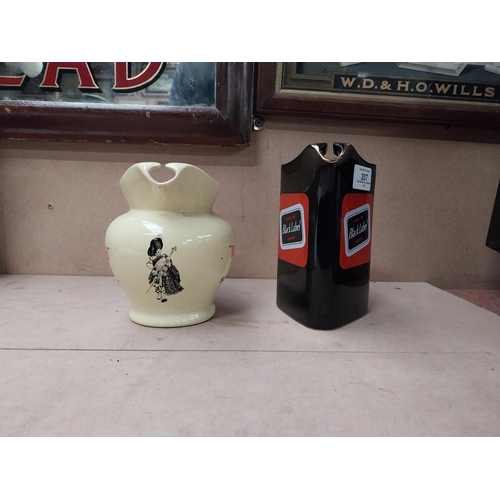 207 - Black Label Wade water jug {16 cm H x 15 cm W x 10 cm D} and Dewars White Label water jug {13 cm H x... 