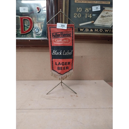 209 - Carling Black Label banner on stand {34 cm x 11 cm W} and Toby Ale adverising banner {28 cm H x 17 c... 