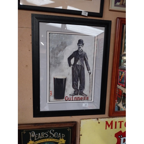 22 - Framed Charlie Chaplin Guinness advertising print. {66 cm H x 50 cm D}.