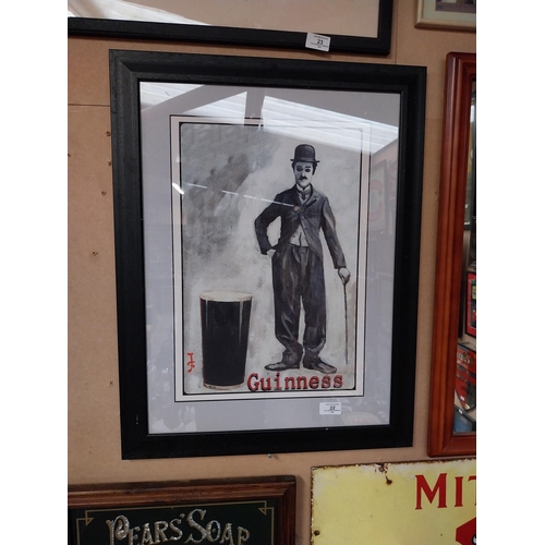 22 - Framed Charlie Chaplin Guinness advertising print. {66 cm H x 50 cm D}.