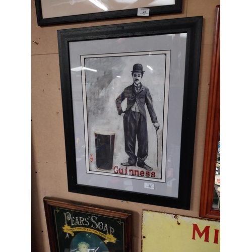 22 - Framed Charlie Chaplin Guinness advertising print. {66 cm H x 50 cm D}.