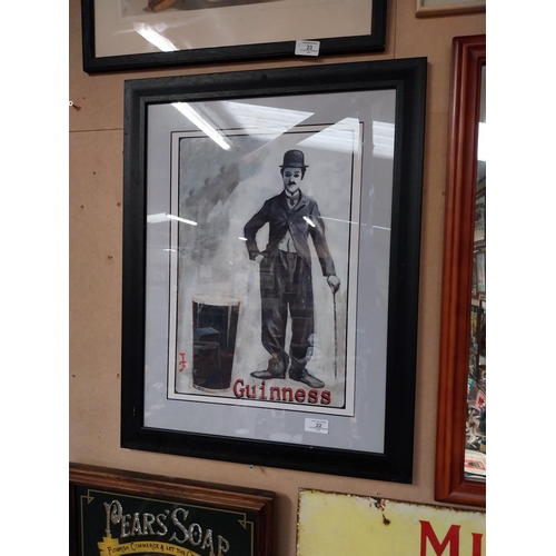 22 - Framed Charlie Chaplin Guinness advertising print. {66 cm H x 50 cm D}.