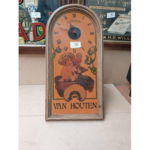 220 - 1970�s Van Houten�s advertising wall clock. {43 cm H x 21 cm W}.