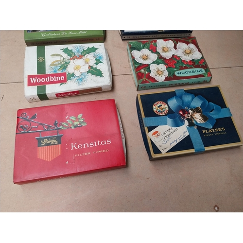 226 - Collection of seven Chrismas themed cigarette boxes � Gallaher�s, Player�s and Woodbine. {11 cm H x ... 