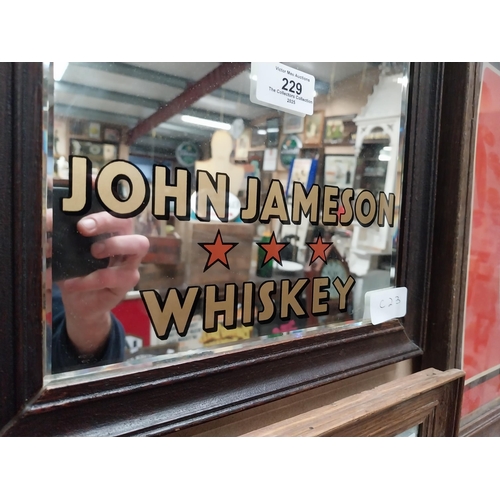 229 - Framed John Jameson Whiskey advertising mirror. {37 cm H x 28 cm W}