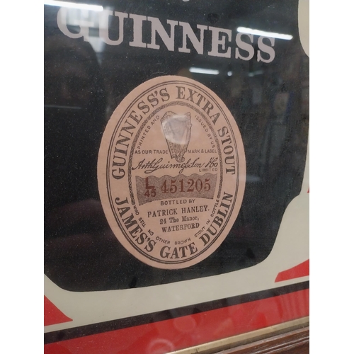 235 - Guinness Patrick Hanley of Waterford framed advertising print {42 cm H x 52 cm W}.