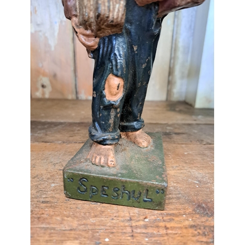 248 - Cast iron newspaper boy advertising figure  H 18cm x W 6cm x D 7cm. NOT AVAILABLE TO VIEW IN PERSON.