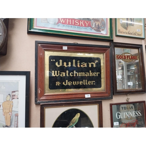 254 - Julian Watchmaker & Jeweller reverse painted glass framed advertising sign {41 cm H x 56 cm W}.