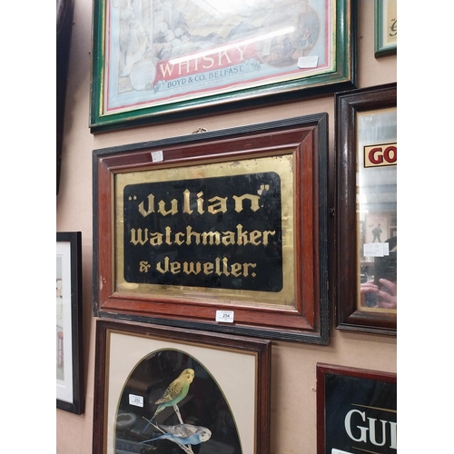 254 - Julian Watchmaker & Jeweller reverse painted glass framed advertising sign {41 cm H x 56 cm W}.