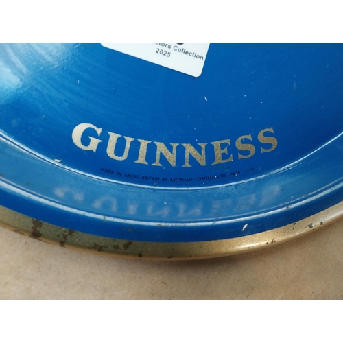 269 - Blue Guinness tin plate drinks tray . {2 cm H x 27 cm Diam.}.