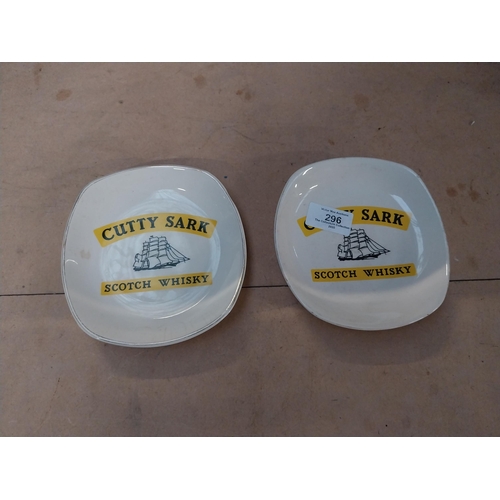 296 - Two Cutty Sark Scotch Whiskey Wade ceramic advertising ashtrays. {2 cm H x 14 cm W x 14 cm D}.