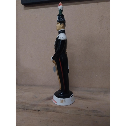 304 - Liquore Galliano advertising bottle in the form of a Guard. {35 cm H x 9 cm Dia.}.