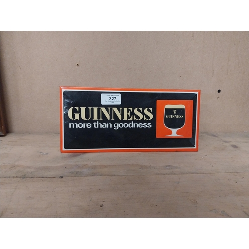 327 - Guinness More Than Goodness celluloid shelf sign. {13 cm H x 28 cm W}.