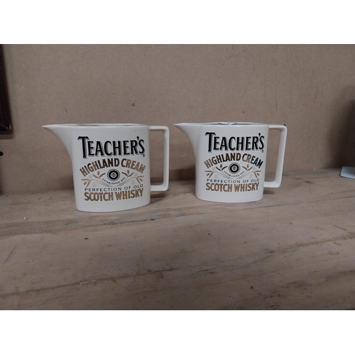 340 - Two Teachers Highland Cream Scotch Whiskey water jugs. {13 cm H x 28 cm W}.